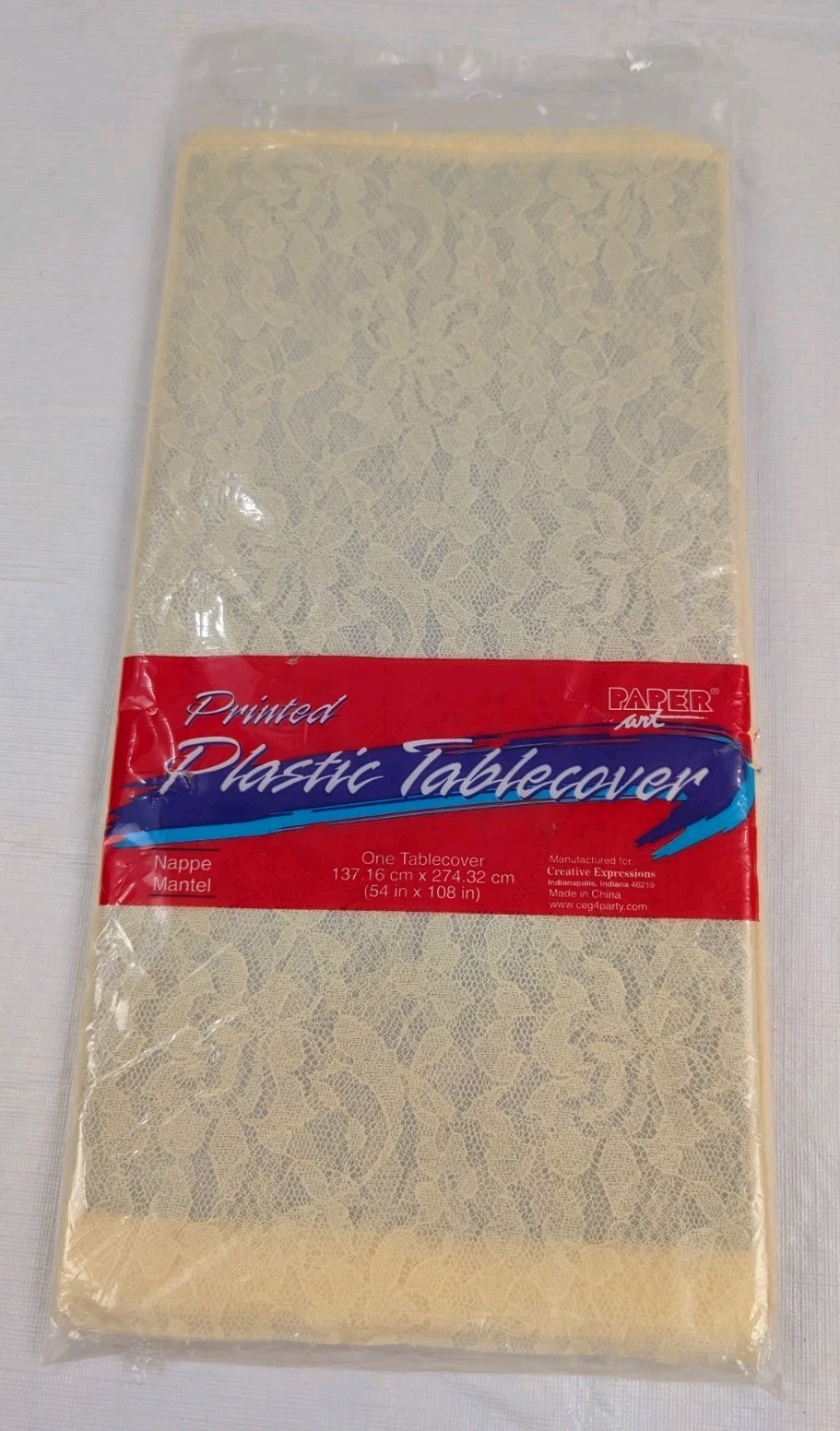 Creative Expression Paper Art Printed Lace Plastic Tablecover 54″x108″ NIP Cream
